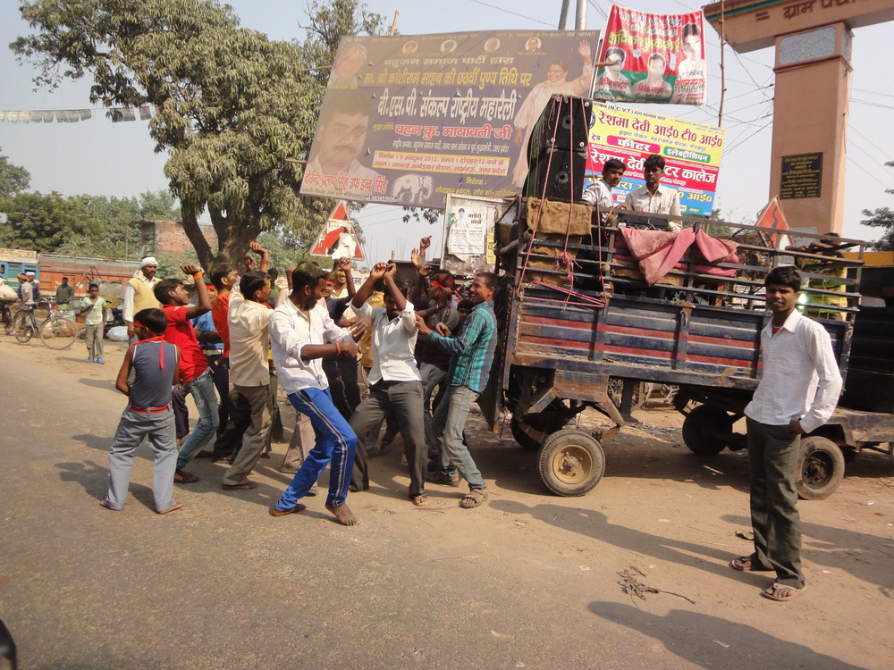Speakers are blazing on the back of a truck - en route to Varanasi, India.