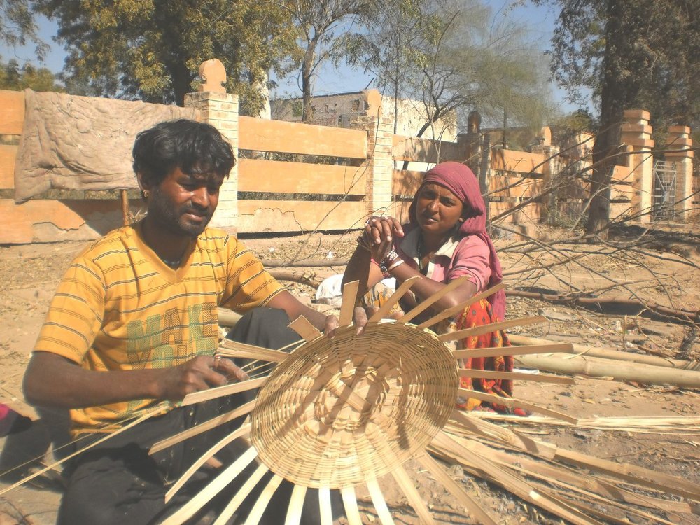 Thar Desert men and women weaving bamboo baskets. Photo credit: Ashok Bishnoi