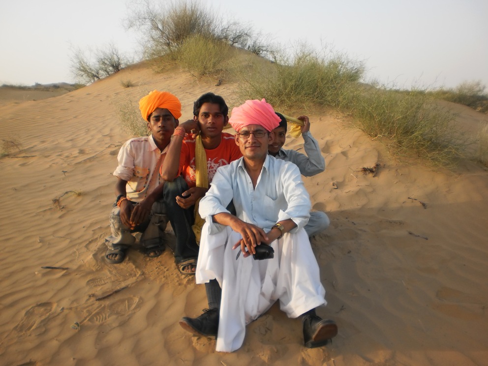 Villagers enjoying time in the sand dunes with Ashok. Photo credit: Ashok Bishnoi