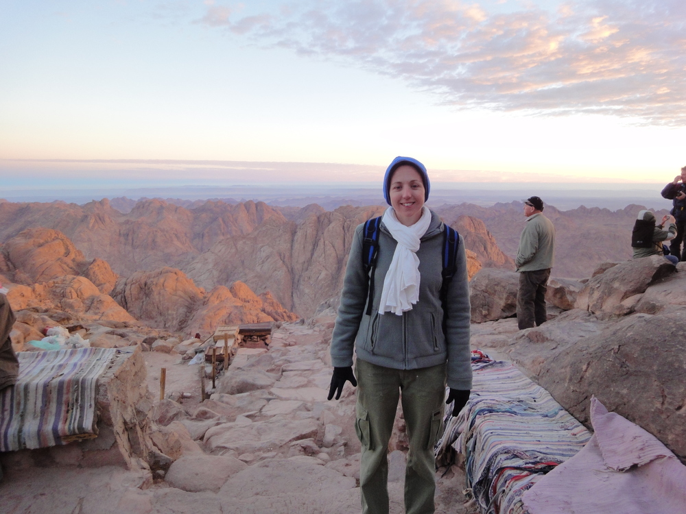 Me greeting sunrise at the summit of Mount Sinai in Egypt.
